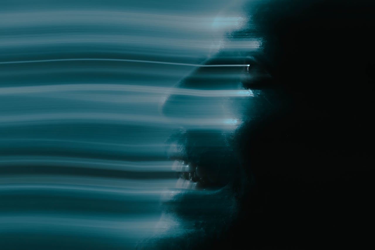 why-choose-us Artistic abstract portrait of a man's face using motion blur for a spooky and creative effect.